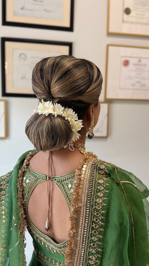 Bridal updo with fresh flowers